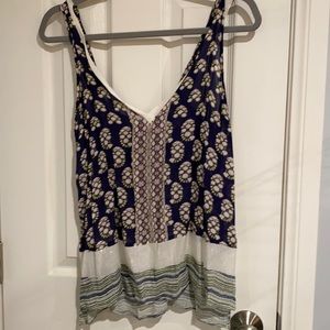 Zara collection.  Size med. strapped blouse. Figures with navy blue colors cream